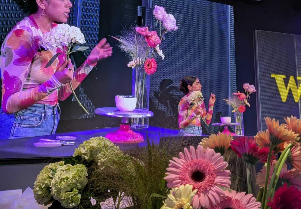 Claudia Lapena leads a floral arranging workshop at WBUR CitySpace. (Hanna Ali/WBUR)