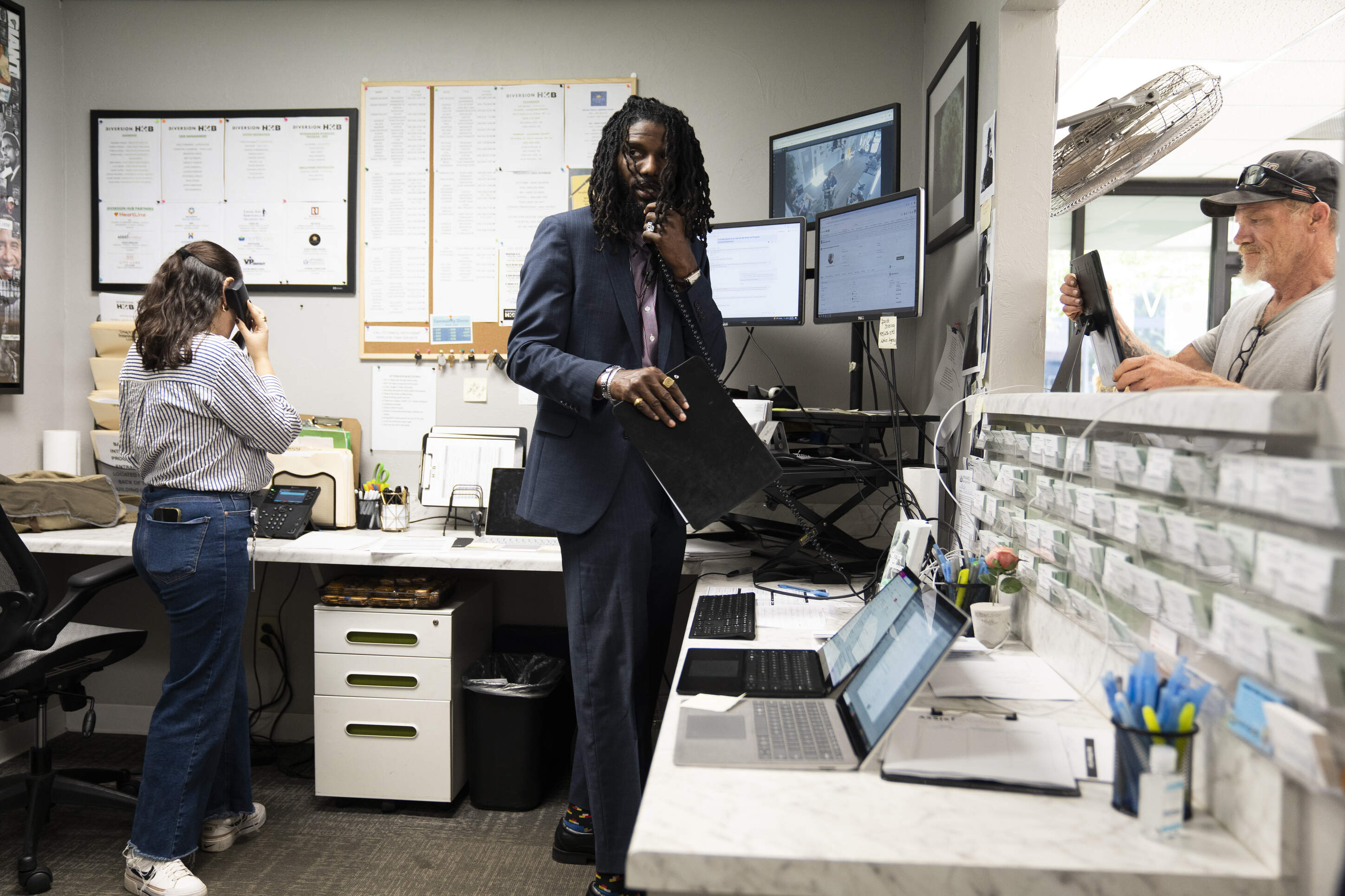 Jermaine Vick speaks on the phone to a client at the intake desk of Diversion Hub in Oklahoma City, Oklahoma on Wednesday August 20, 2025. (Nick Oxford for Here &amp; Now)