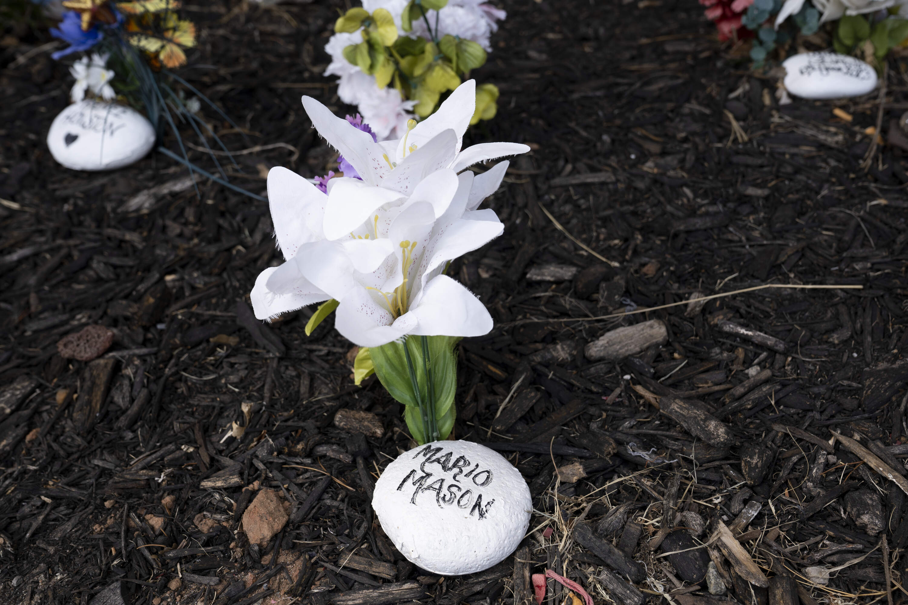 A stone for Mario Mason sits in a memorial garden in front of the Oklahoma County Jail in Oklahoma City, Oklahoma on Thursday August 21, 2025. (Nick Oxford for Here &amp; Now)