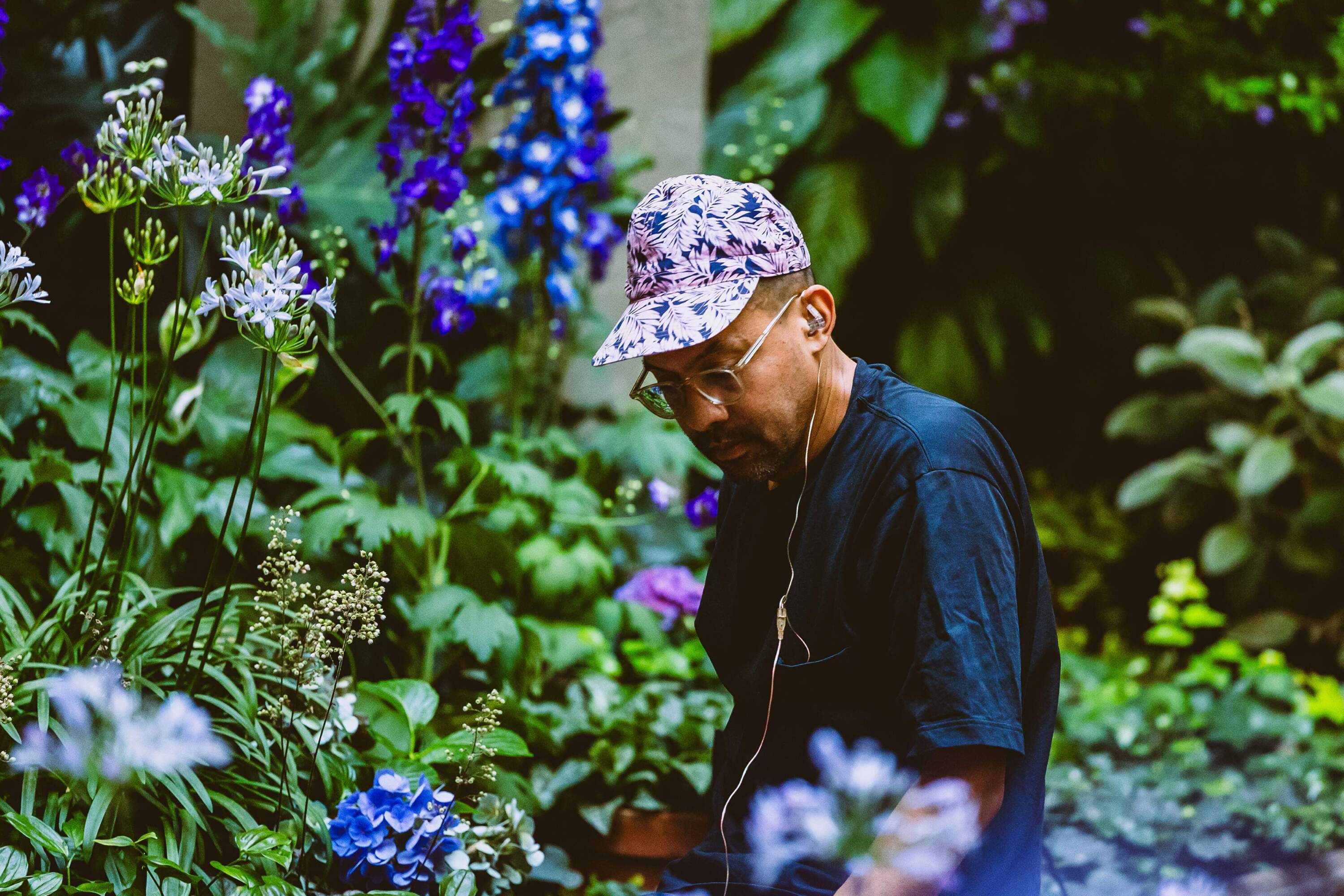Laposky in the courtyard at the Isabella Stewart Gardner Museum in 2023. He first performed with the plants there in 2017. (Courtesy Steve Osemwenkhae)