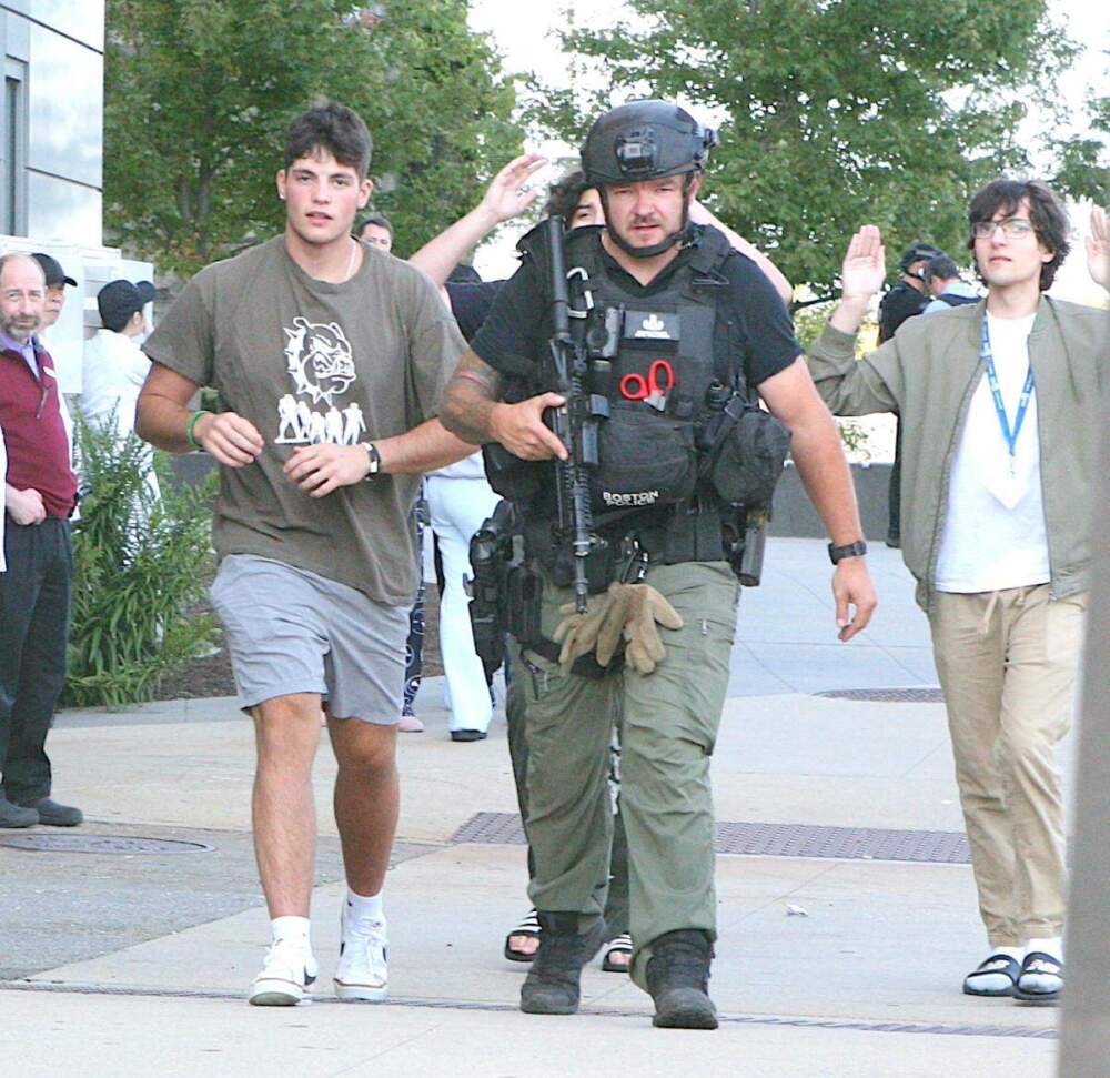 Police evacuated students from the rear of a UMass Boston dorm building on Thursday. (Seth Daniel/Dorchester Reporter)