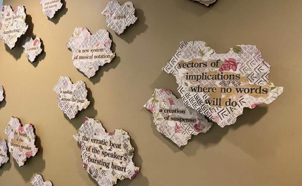 A wall of writings at the Emily Dickinson Museum describes the poet’s relationship to the em-dash punctuation mark. (Karen Brown/NEPM)