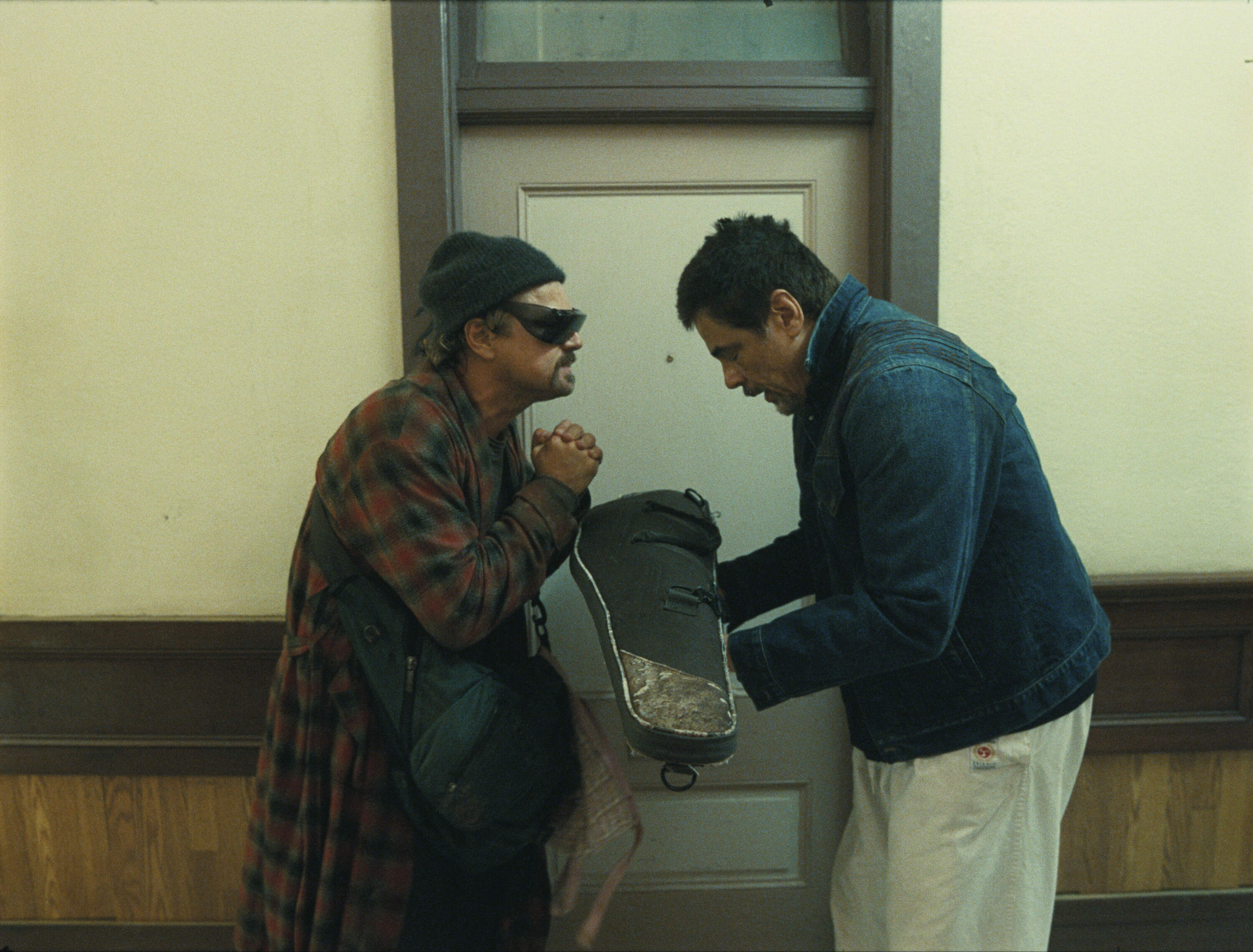Leonardo DiCaprio and Benicio Del Toro in director Paul Thomas Anderson's "One Battle After Another." (Courtesy Warner Bros. Pictures)