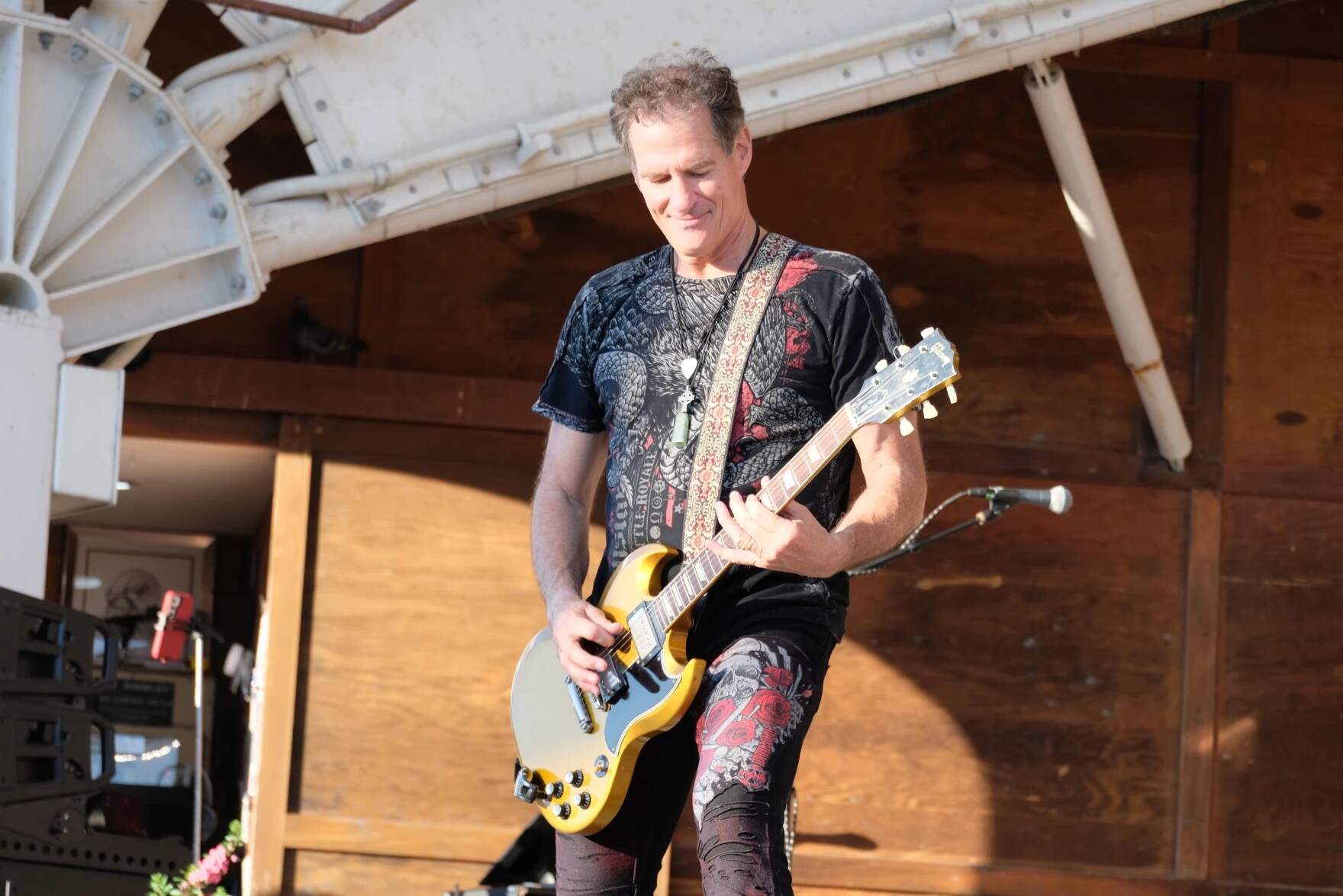 Scott Brown, seen on stage at Hampton Beach earlier this summer, is juggling gigs as a frontman for his rock band — and as a candidate for U.S. Senate. (Todd Bookman/NHPR)