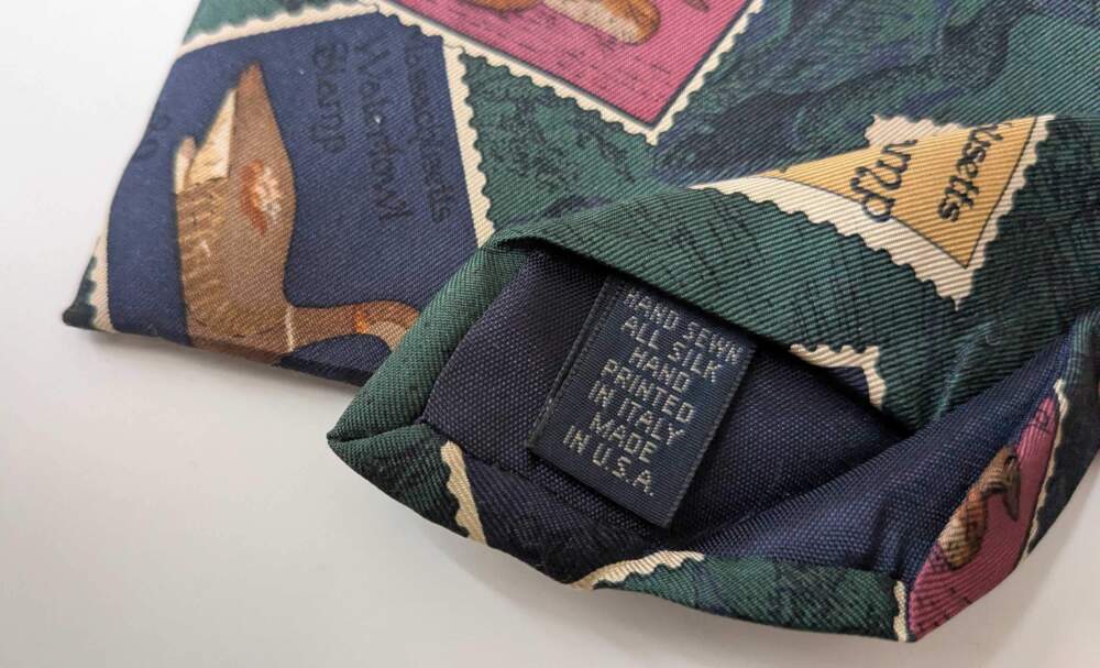 The label on this vintage necktie shows its fabric makeup and where it was made. (Hanna Ali/WBUR)