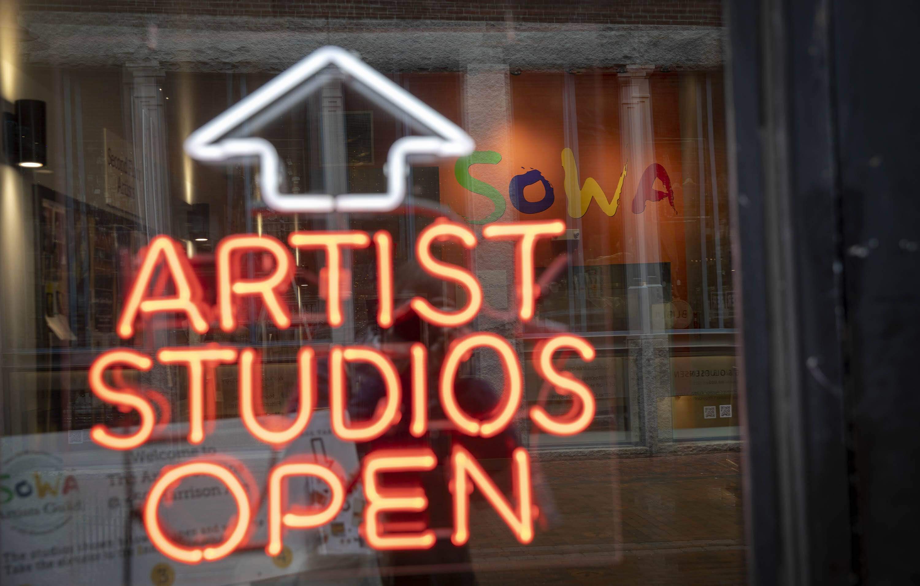 An "artist studios open" sign at the SoWa Art and Design District in Boston. (Robin Lubbock/WBUR)