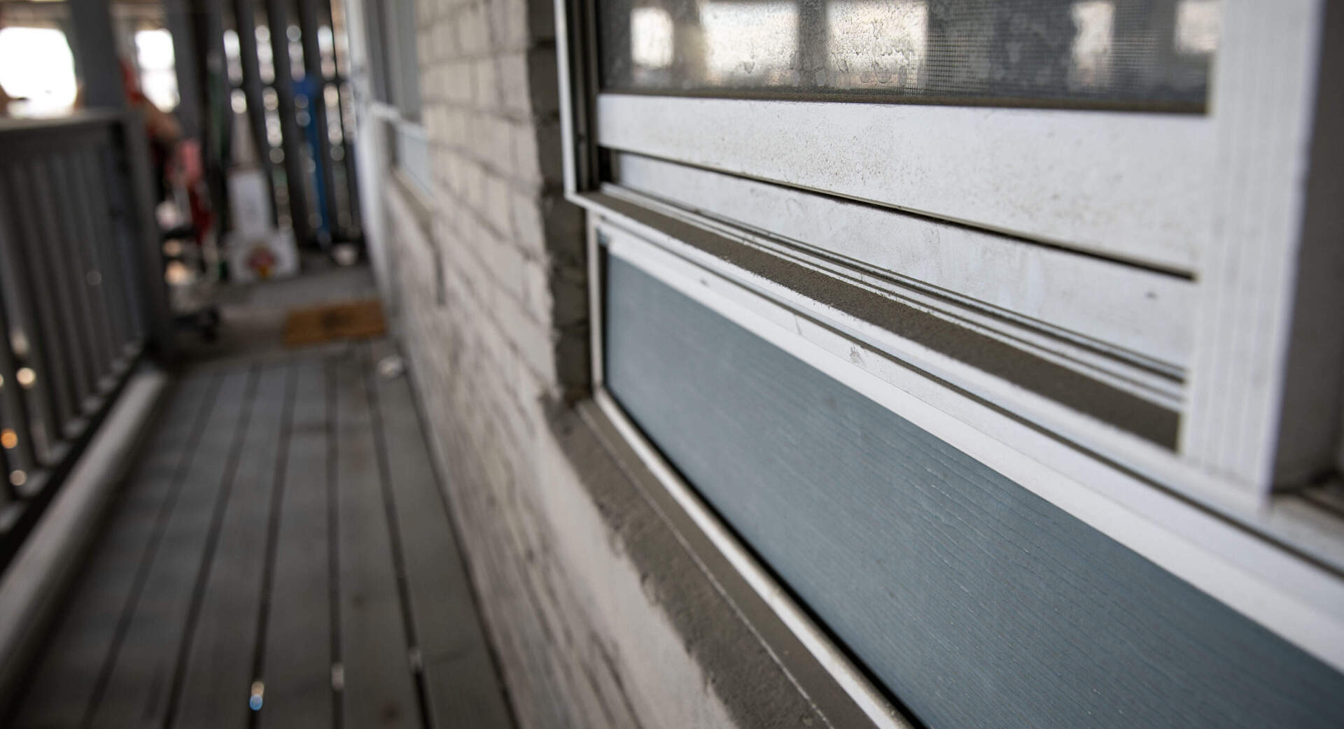 A thick layer of dirt on a window at Henriquez's apartment (Robin Lubbock/WBUR)