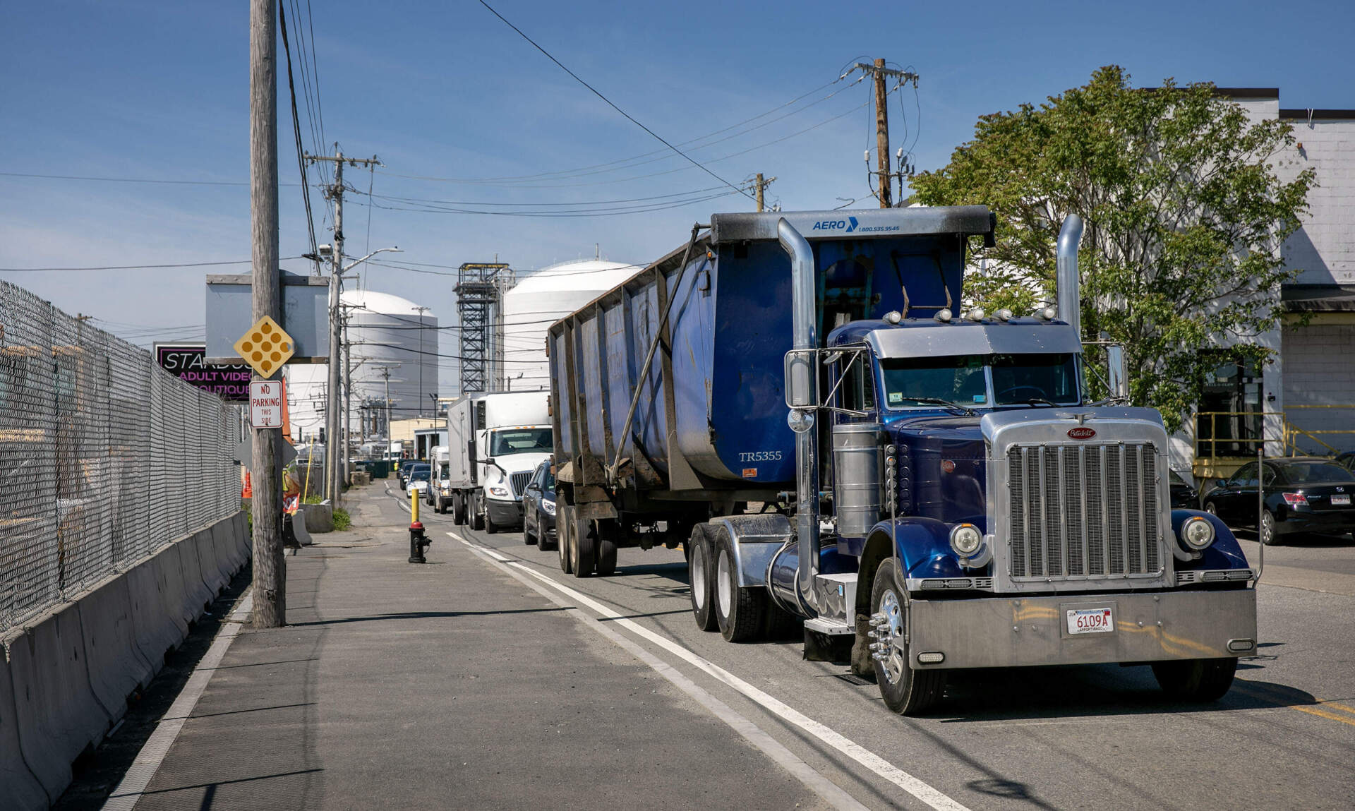 Heavy trucks roll along Beacham Street in Chelsea. (Robin Lubbock/WBUR)