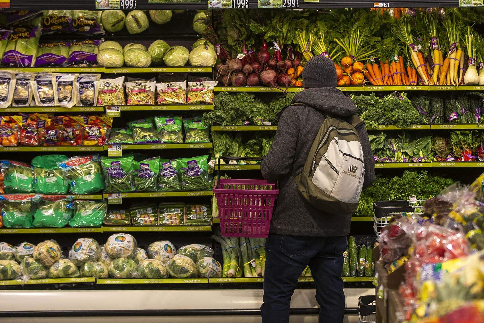 A customer shops for groceries in West Roxbury in 2019. (Jesse Costa/WBUR File)