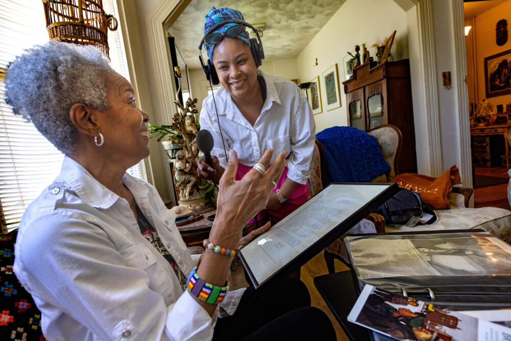 WBUR reporter Arielle Gray (right) with artist Johnetta Tinker. (Jesse Costa/WBUR)