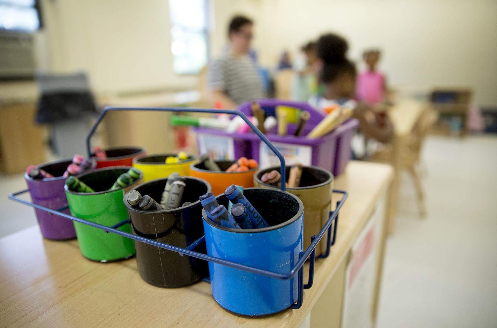 Colored crayons sit on a table at Roxbury Head Start. (Robin Lubbock/WBUR)