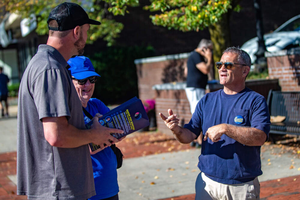 Frank Baker speaks with canvassers before they head out to knock on doors in West Roxbury. (Jesse Costa/WBUR)