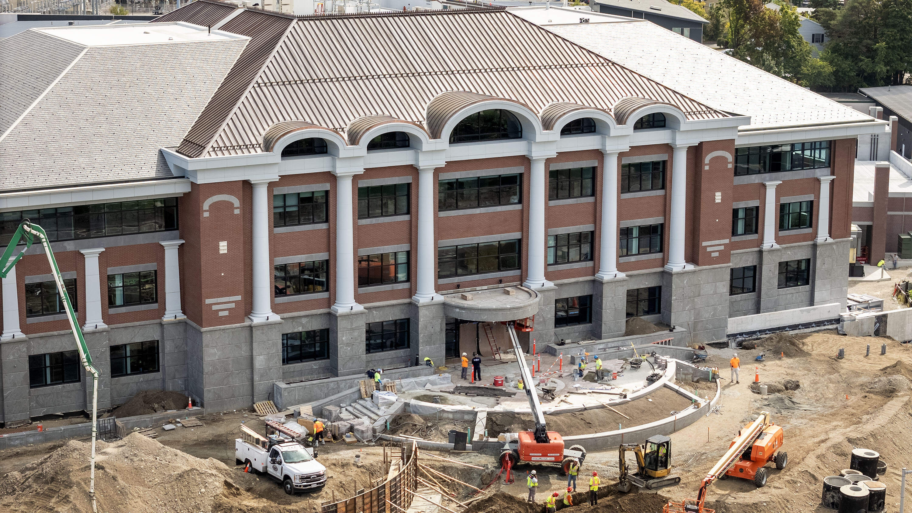 The new public safety building in Quincy, under construction with two spaces at the front of the building for statues of St. Michael and St. Florian. (Robin Lubbock/WBUR)