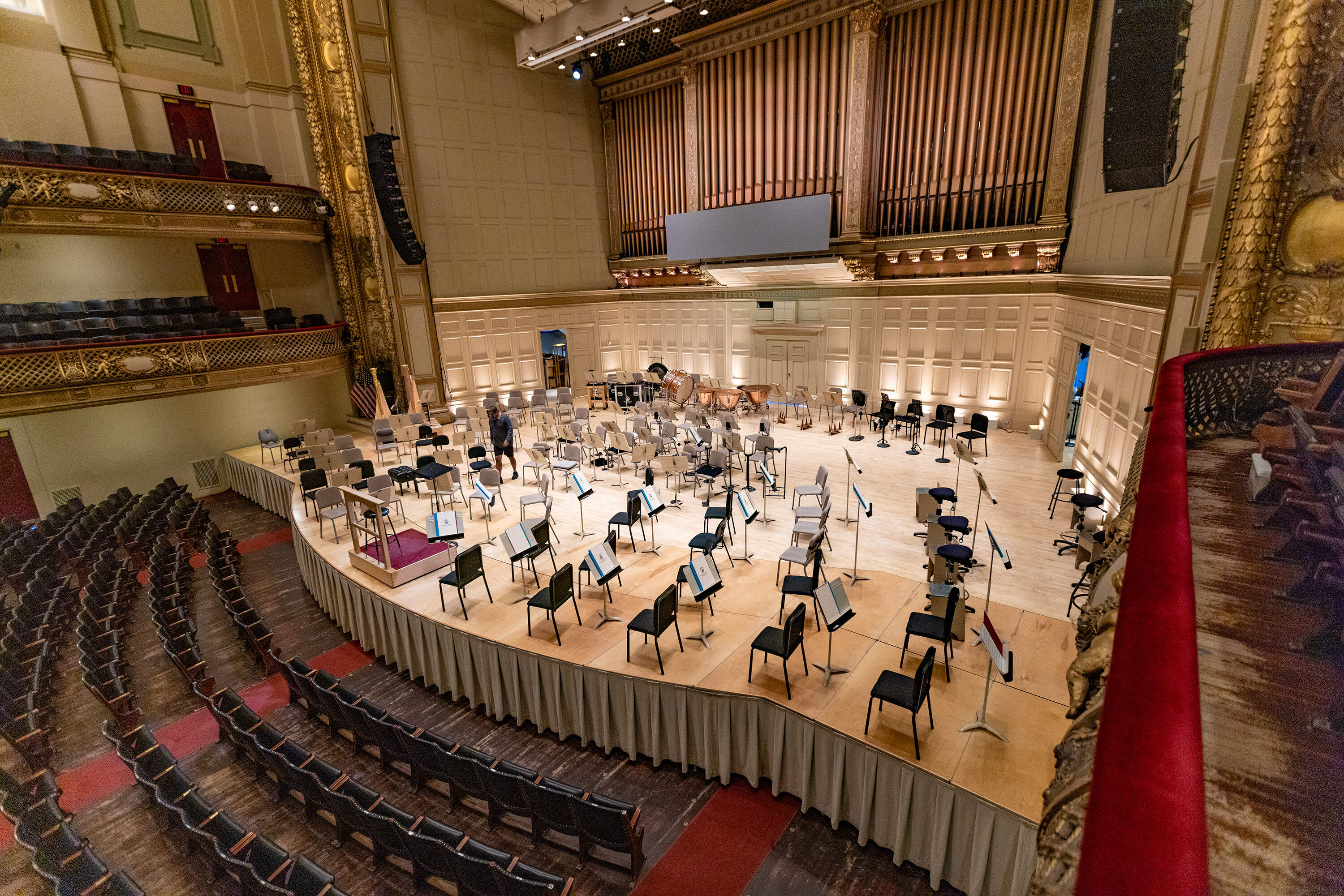 A Stage Worker Walks Around The Stage of Symphony Hall Setting Up Fort. (Esse costa / wbur)