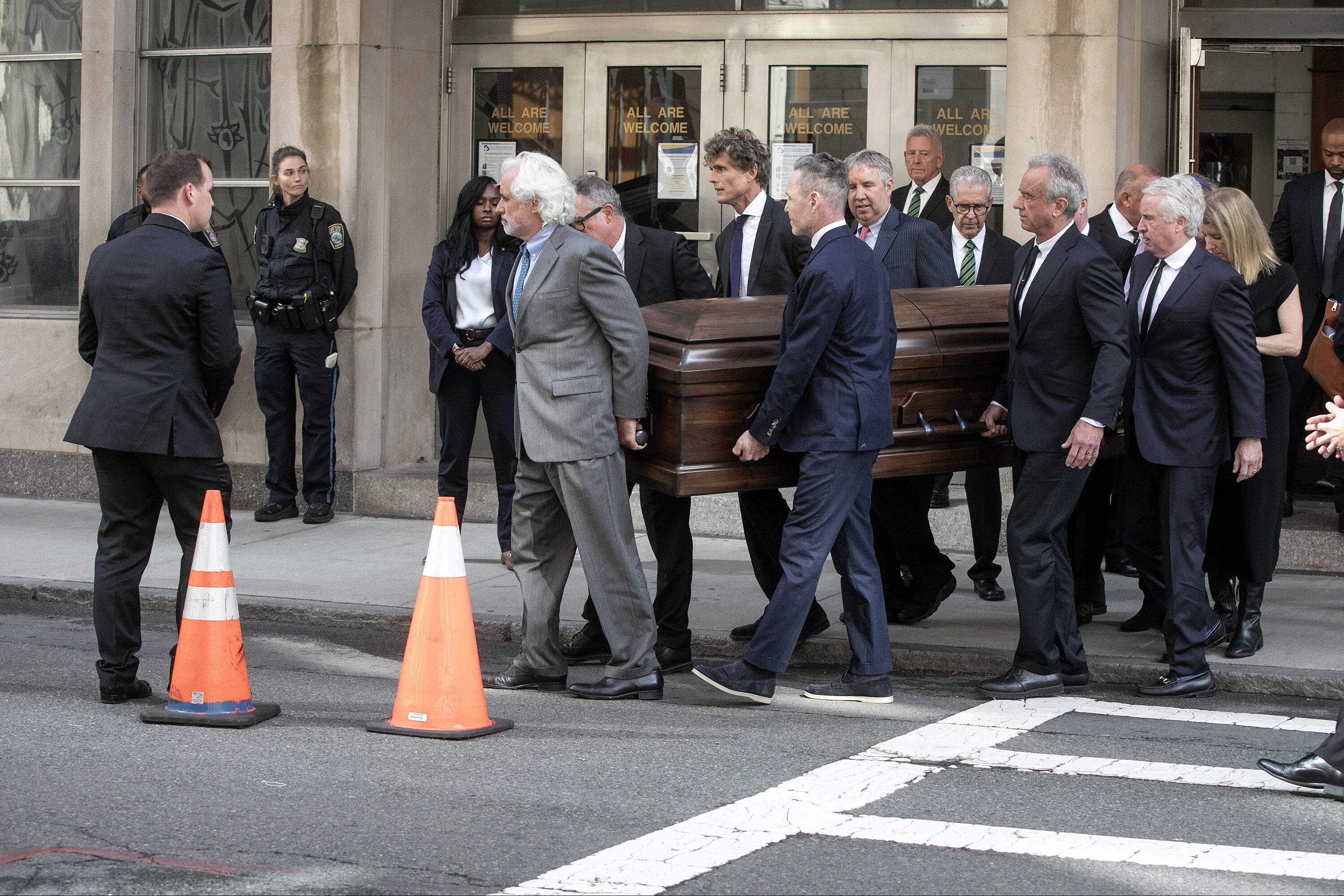 Pallbearers carry the coffin of Joan Bennett Kennedy. (Robin Lubbock/WBUR)