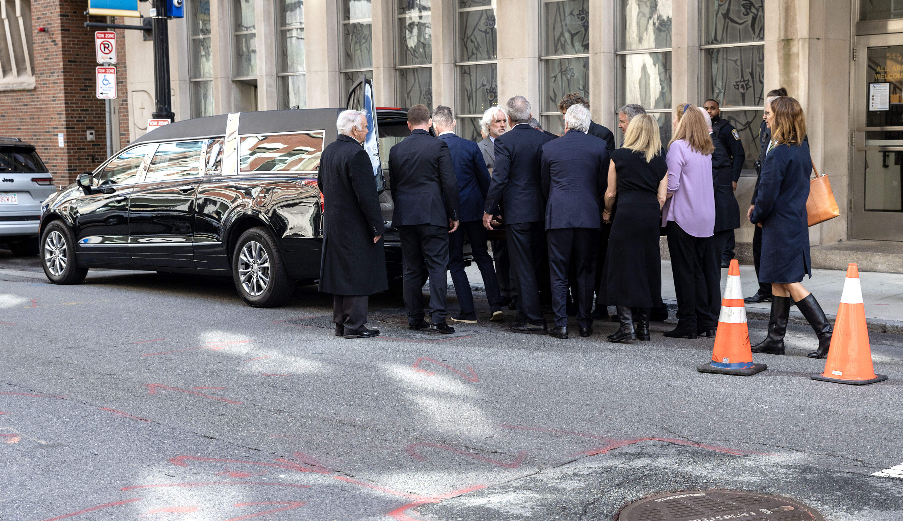 Pallbearers load the coffin of Joan Bennett Kennedy into a hearse outside St. Anthony Shrine in downtown Boston. (Robin Lubbock/WBUR)