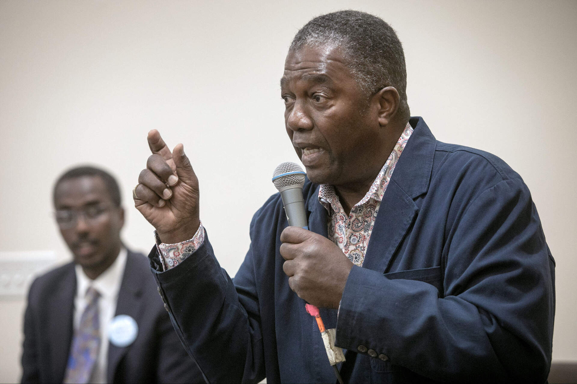 Miniard Culpepper speaks at the forum at the Dudley Street Neighborhood Initiative. (Robin Lubbock/WBUR)
