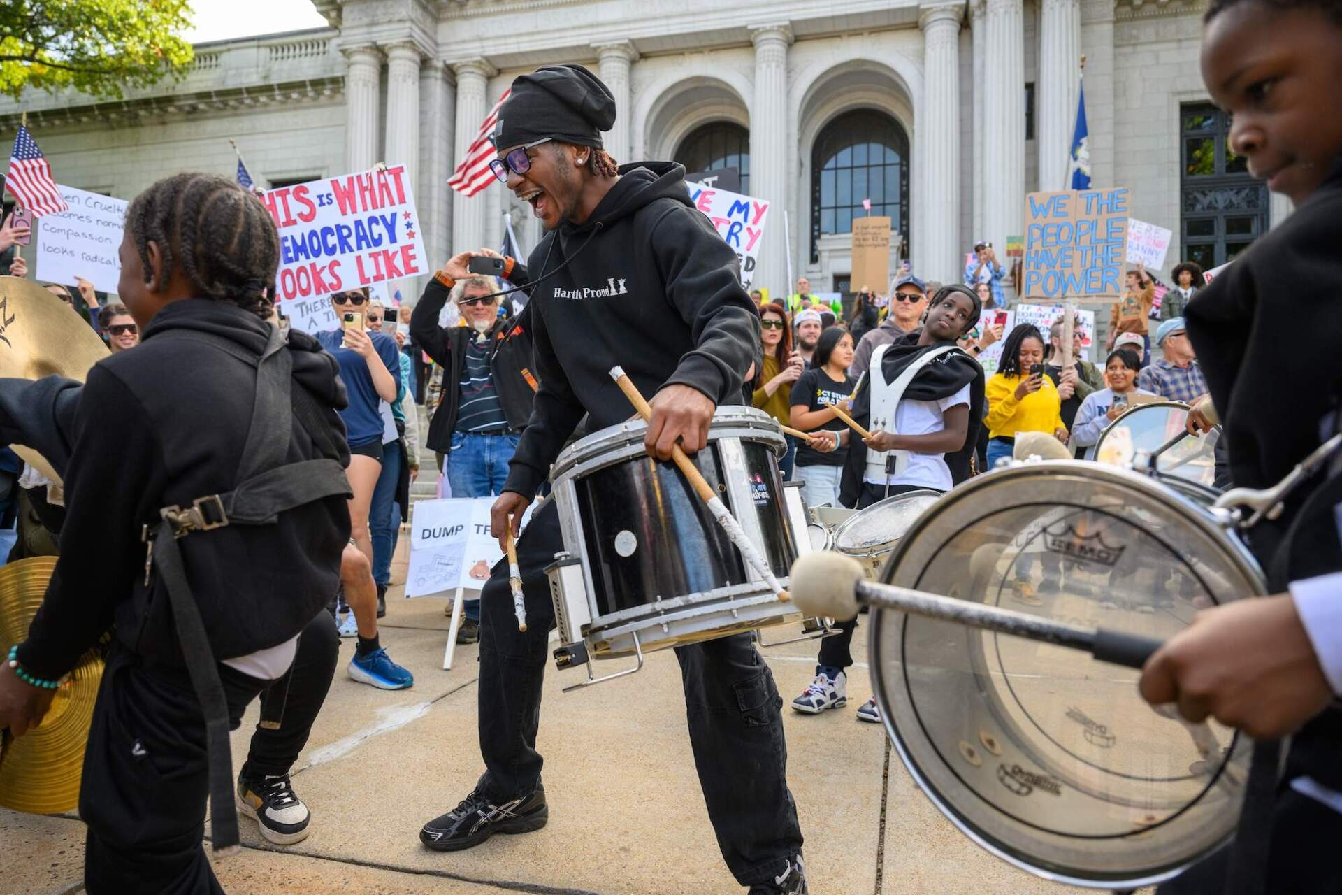 Members of Hartford’s Proud Drill, Drum, and Dance Corp perform outside the Connecticut Supreme Court. (Mark Mirko/Connecticut Public)