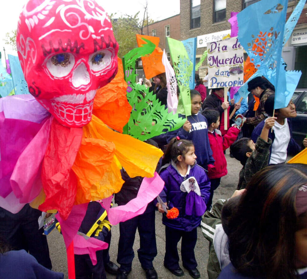 Elementary school children, parents and people from the community, begin a procession through Chicago's Pilsen /Little Village neighborhood celebrate the tradition of Dia de los Muertos on November 1, 2001. Charles Bennett/AP)