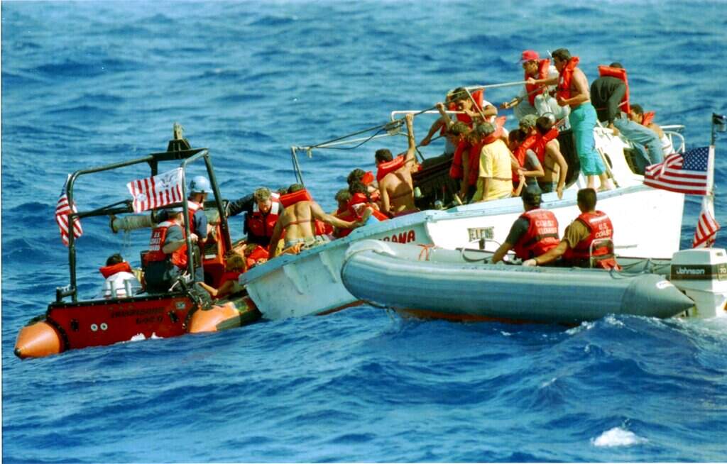A U.S. Coast Guard crew from the cutter Staten Island is hindered by rough seas in the Florida Straits as they attempt to rescue Cuban refugees on August 27, 1994. (Roberto Schmidt/AP)
