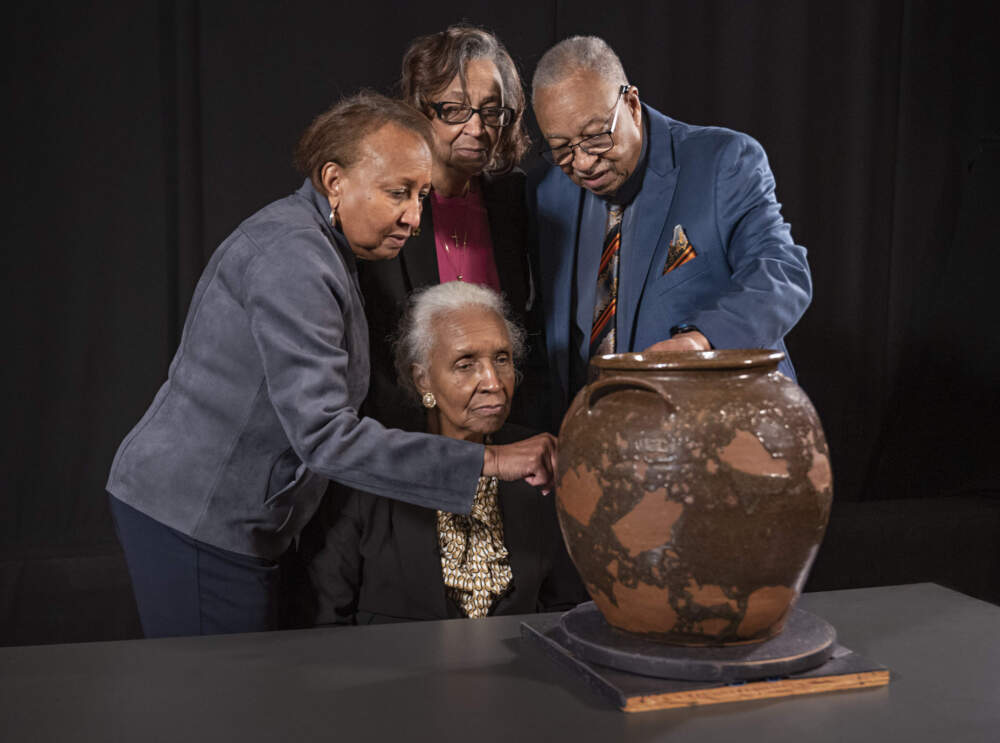 Pauline Baker, Daisy Whitner, John Williams, and Priscilla Williams Carolina, descendants of potter David Drake, at the Museum of Fine Arts, Boston, with one of the artist’s works. (Courtesy Museum of Fine Arts, Boston)