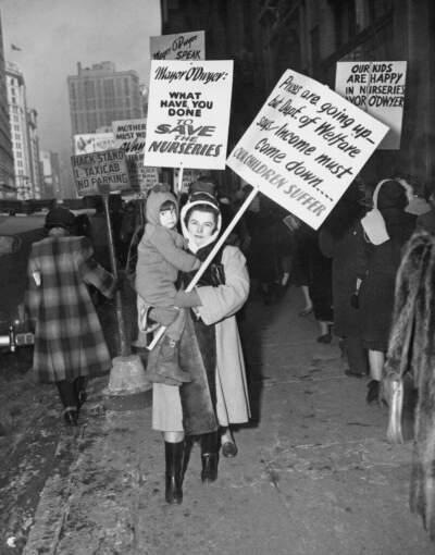 A mother and her child protest against the proposed curtailment of the daycare program for children outside the offices of the City Welfare Department in New York City in February 1948. (European/FPG/Archive Photos/Hulton Archive/Getty Images)