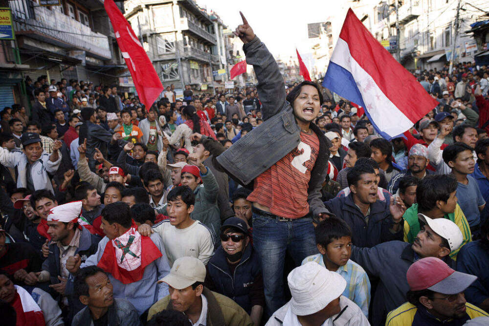 Nepalese political activists chant slogans against King Gyanendra at a pro-democracy protest rally in Kathmandu, 19 April 2006. (Brian Sokol/AFP via Getty Images)