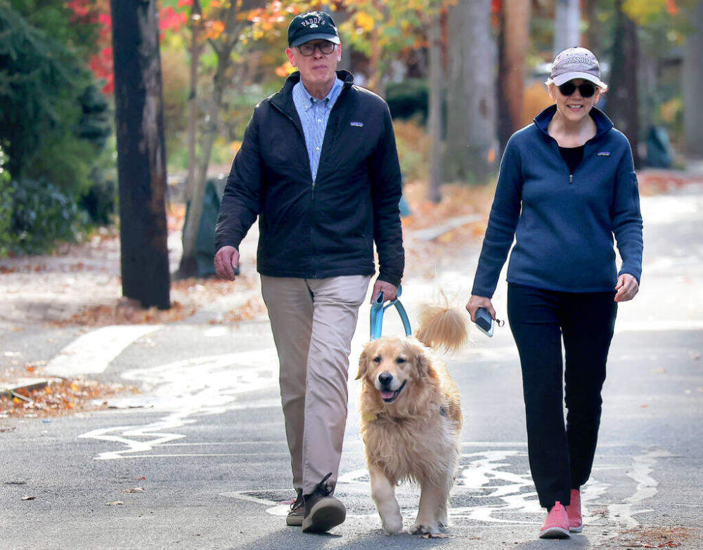 US Senator Elizabeth Warren and her husband Bruce Mann walked with their dog Bailey to their polling place, the Graham and Parks School. (Lane Turner/The Boston Globe via Getty Images)