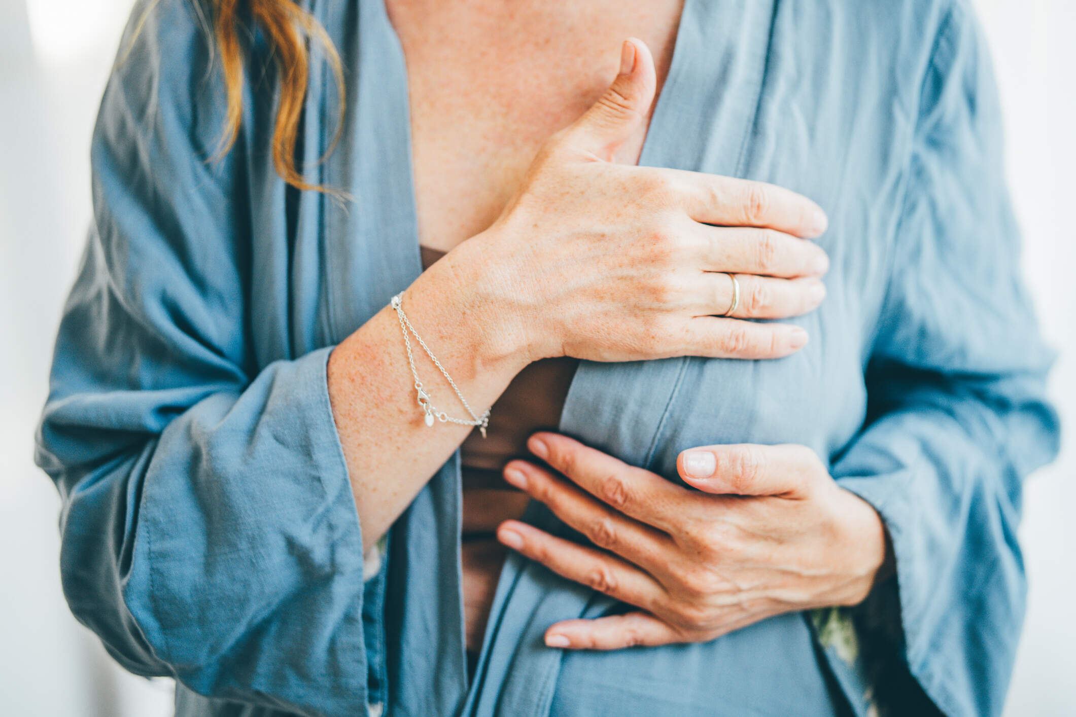A woman performs a breast self-exam. (Getty Images)
