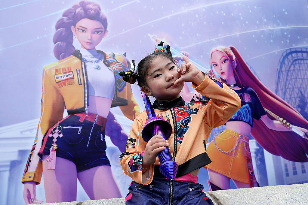 A model wearing a costume based on the character Rumi poses for photographs at the KPop Demon Hunters themed zone at Everland on September 30, 2025 in Yongin, South Korea. The park opened a new themed zone on 26 September, in collaboration with Netflix, which features attractions inspired by the animated feature film KPop Demon Hunters. (Photo by Han Myung-Gu/WireImage)