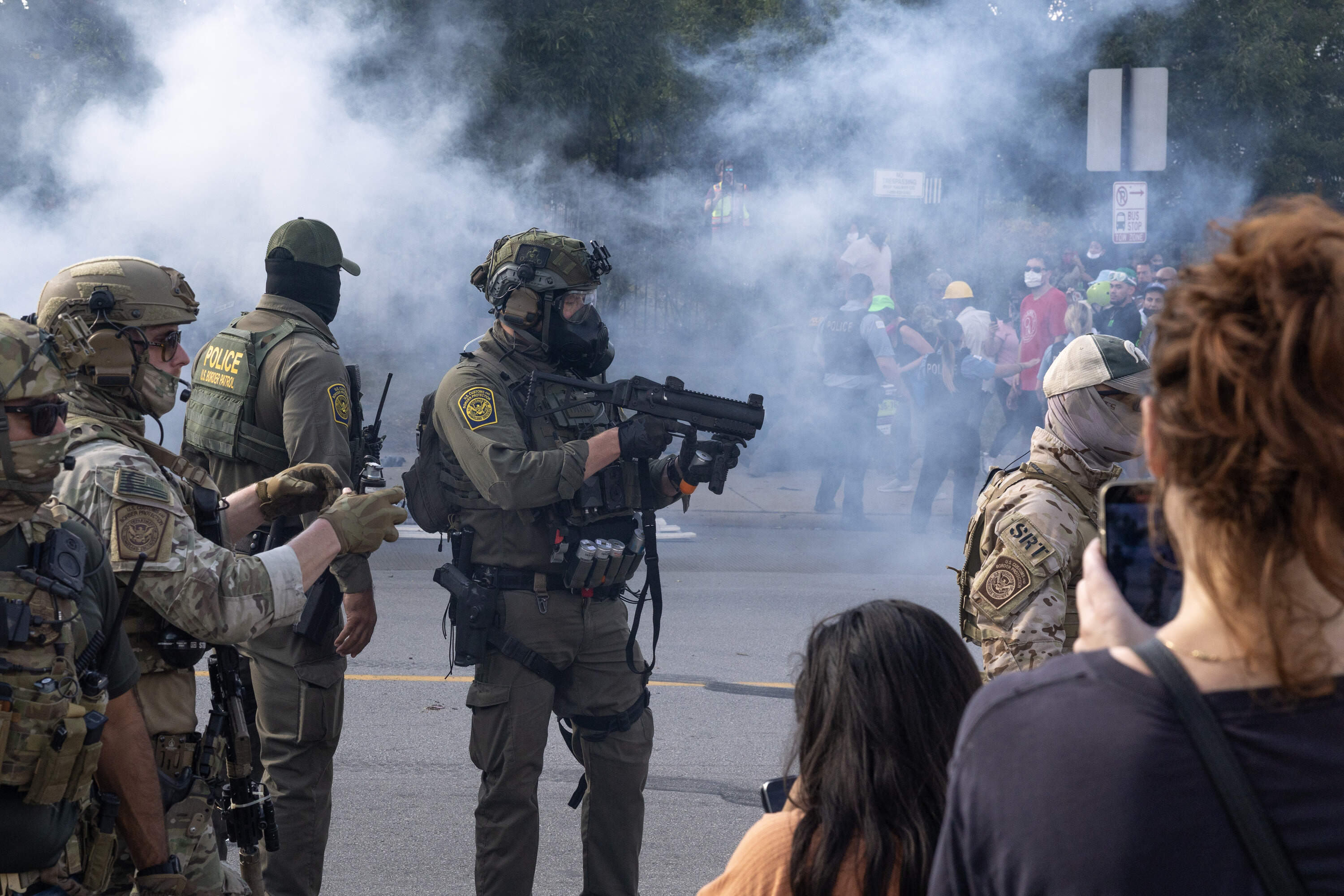 Tear gas fills the air after it was used by federal law enforcement agents who were being confronted by community members and activists for reportedly shooting a woman in the Brighton Park neighborhood on Oct. 4, 2025 in Broadview, Illinois. Residents of the city have become increasingly concerned as Operation Midway Blitz continues in the Chicago area, an operation designed to apprehend and deport undocumented immigrants living in the area. (Scott Olson/Getty Images)