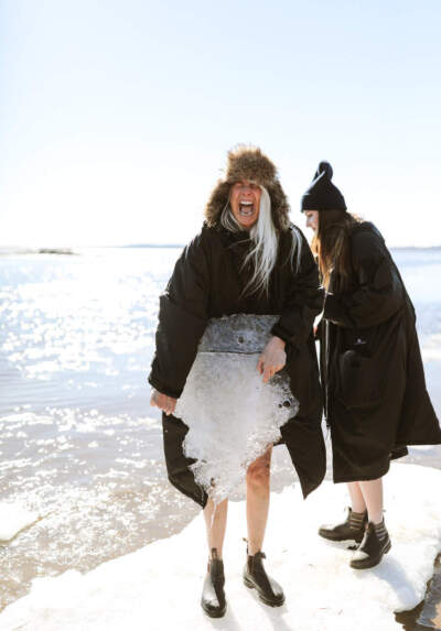 The author, Libby DeLana, holding a large piece of ice. (Courtesy Maaike Bernstrom)