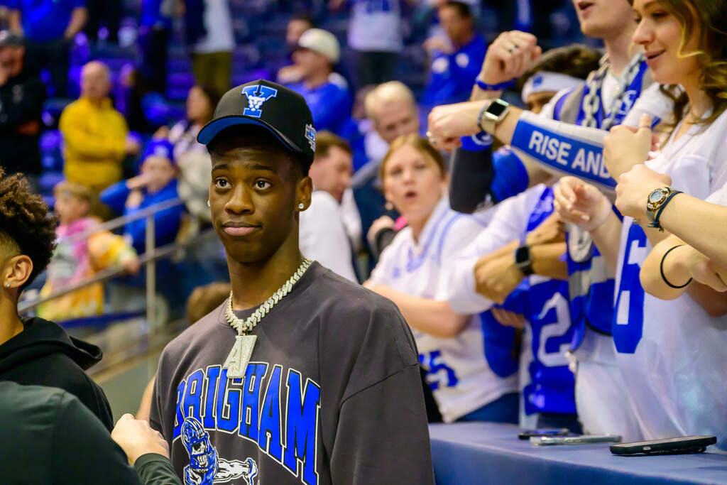 AJ Dybantsa stands with BYU fans during the second half of an NCAA basketball game between BYU and West Virginia Saturday, March 1, 2025, in Provo, Utah. (Tyler Tate/AP)