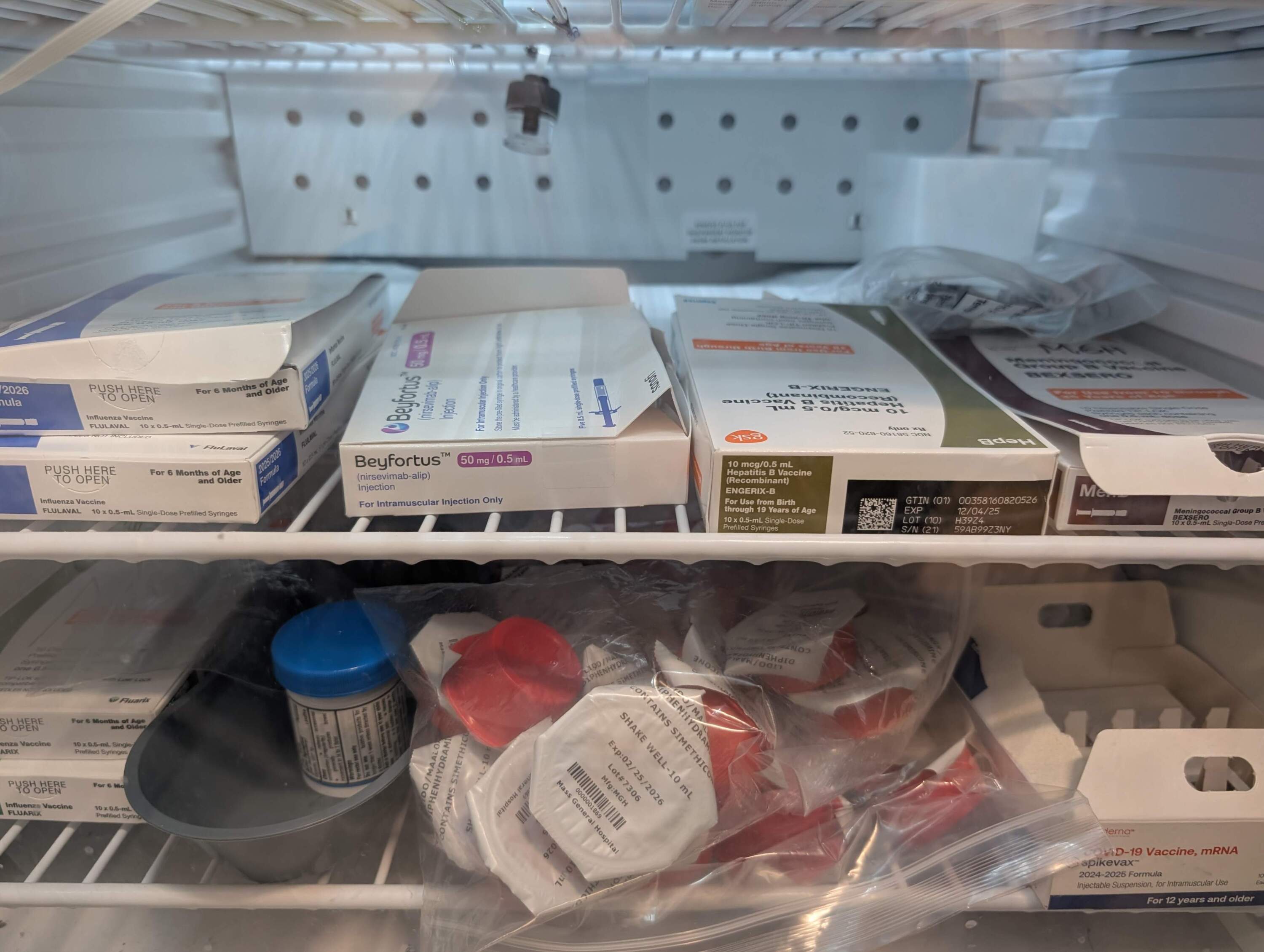 Vaccines stored in a refrigerator at Massachusetts General Hospital's pediatric clinic in Chelsea. (Priyanka Dayal McCluskey/WBUR)