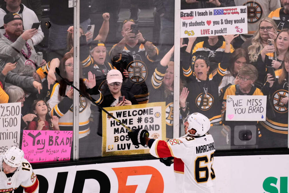 Florida Panthers left wing Brad Marchand (63) flips a puck to fans welcoming the former Bruin back to Boston. (Charles Krupa/AP)