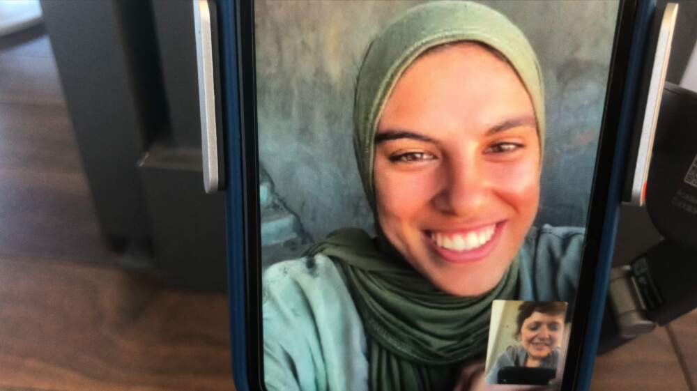 Fatma Hassona and director Sepideh Farsi on a video call in the documentary "Put Your Soul on Your Hand and Walk." (Courtesy Boston Palestine Film Festival)