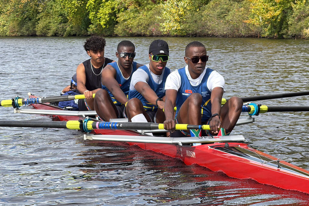 South African rowers, from left, Sheldon Krishnasamy, Lwazi-Tsebo Zwane, Lebone Mokheseng, and Sepitle Leshilo practice on the Charles River in preparation for the Head of the Charles Regatta. (Rodrique Ngowi/AP)