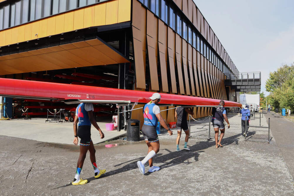 South African rowers carry their boat after practice Wednesday, Oct. 15, 2025, in Boston. (Leah Willingham/AP)