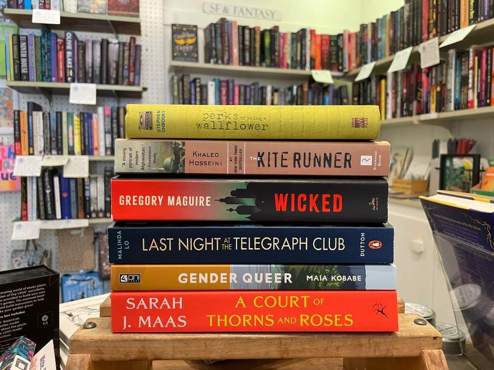 A stack of books that appear on the banned books list, from The Bookshop at Beverly Farms. (Courtesy Hannah Harlow)