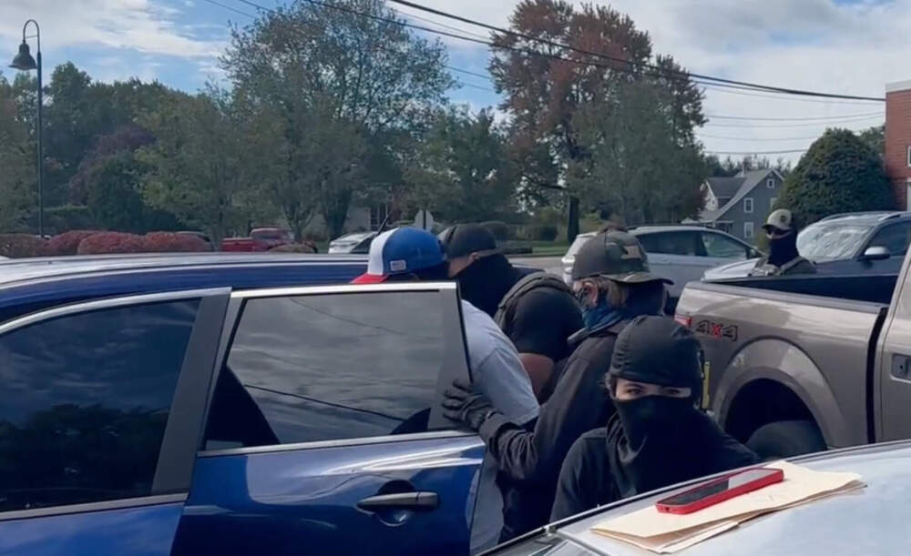 Jesus is arrested after leaving Milford District Court on a recent Friday afternoon. Immigration advocates say the town has seen a heavy concentration of ICE enforcement under a blitz announced by the agency in September. (Simon Rios/WBUR)