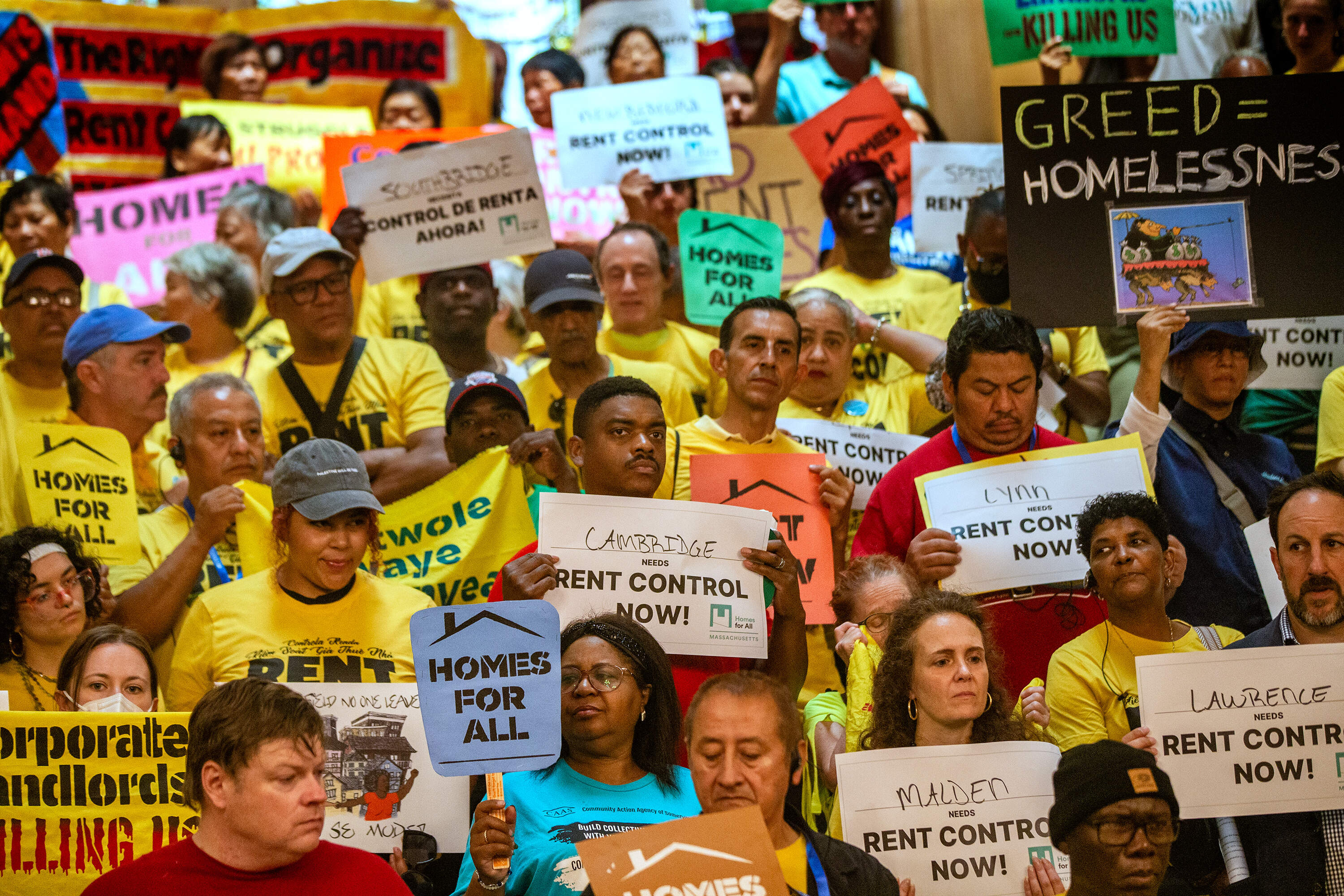 A rally in support of rent control at the Massachusetts State House in July. (Jesse Costa/WBUR)