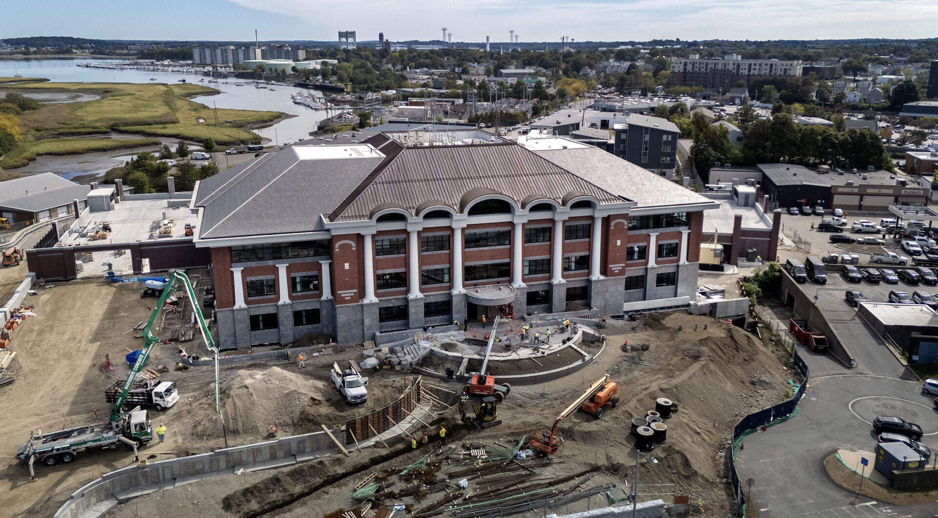 The new public safety building under construction in Quincy. The facade of the building leaves space for two saint sculptures Mayor Koch comissioned. (Robin Lubbock/WBUR)