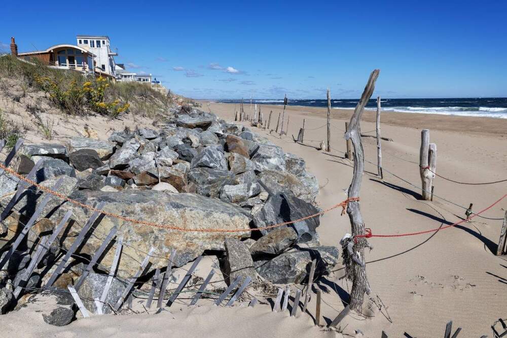 Rocks placed to protect buildings from coastal erosion on Fordham Way on Plum Island. (Robin Lubbock/WBUR)