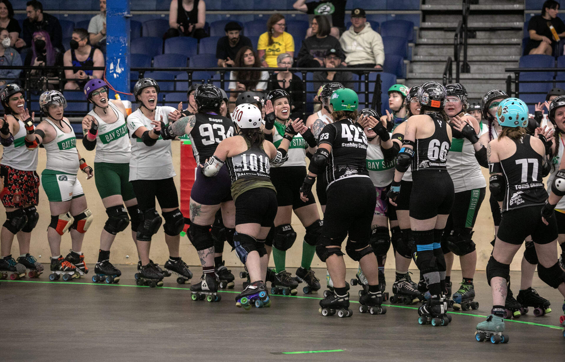 Teams thank and congratulate each other at the end of a roller derby game in Wilmington, Mass. (Robin Lubbock/WBUR)