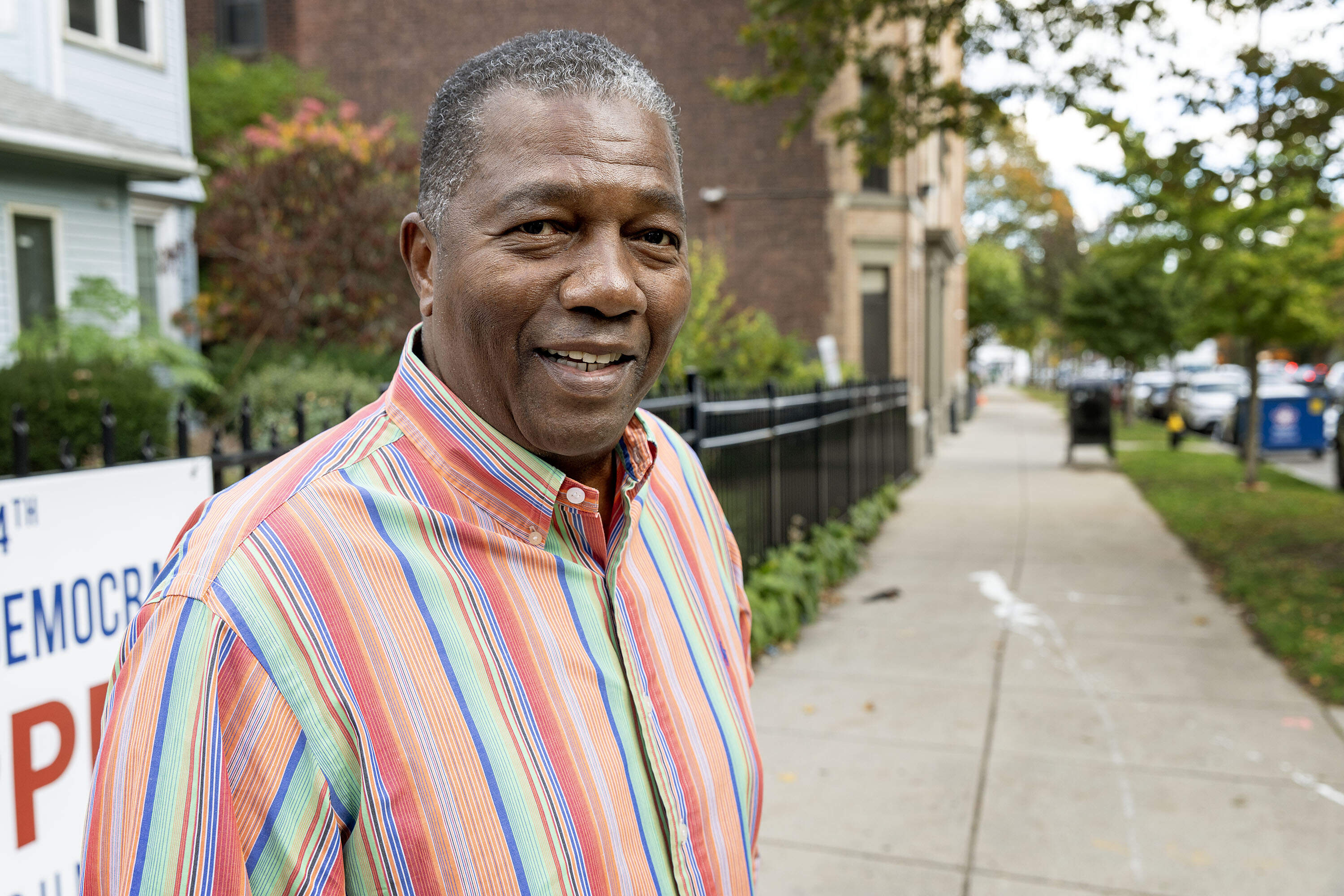Rev. Miniard Culpepper, the unofficial winner of Boston's District 7 city council race, on Seaver St. in Boston in October. (Robin Lubbock/WBUR)