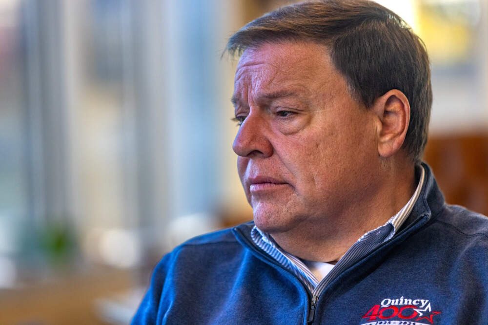Quincy mayor Thomas Koch looks out his office window at City Hall in October. (Jesse Costa/WBUR)