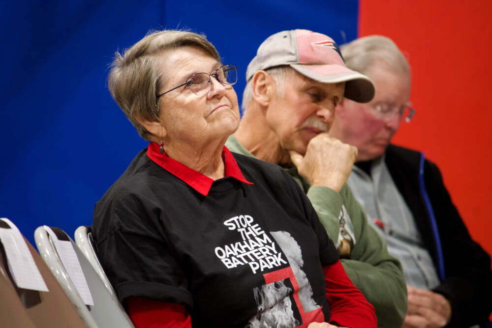 Oakham resident Barbara Wreschinsky waits for her turn to speak during the Energy Facility Siting Board meeting on Oct. 16. (Miriam Wasser/WBUR)