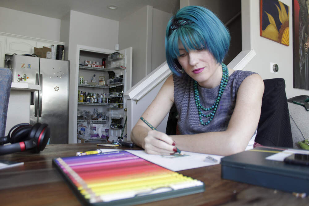 Lynn Hunt uses colored pencil to fill in a sketch at home in Beaverton, Ore., on Wednesday, Aug. 24, 2022. (Gillian Flaccus/AP)