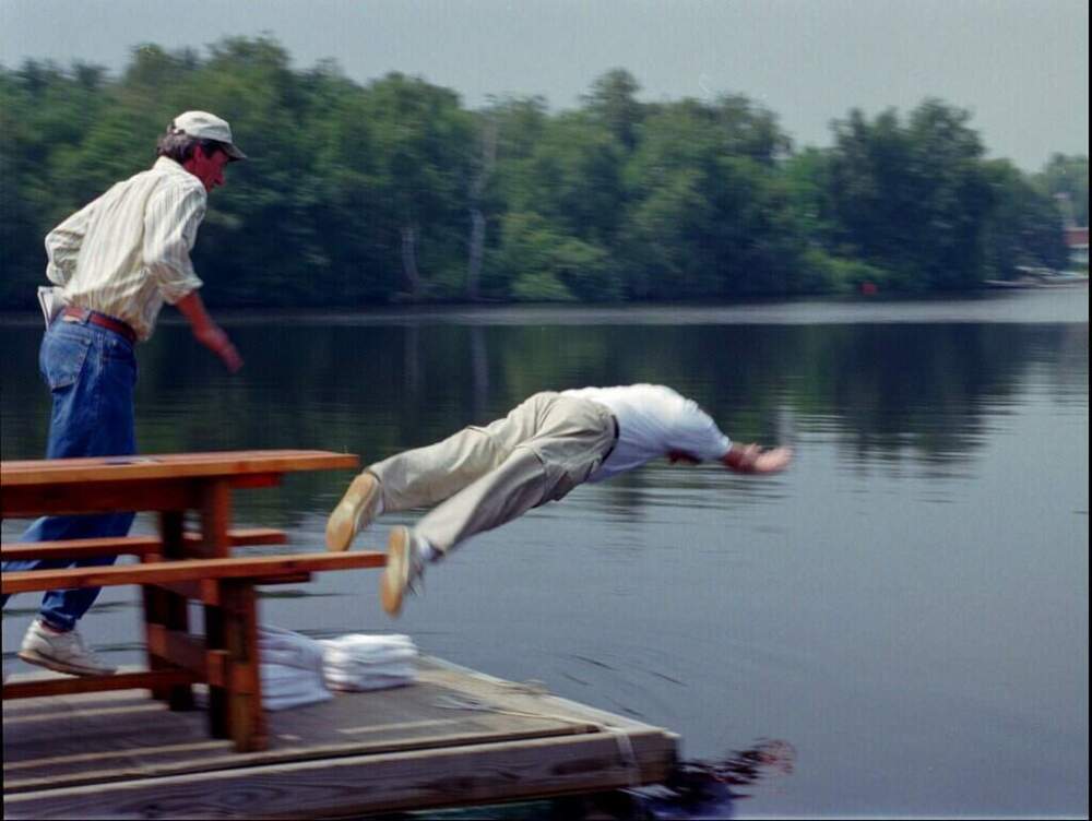 Massachusetts Gov. William Weld takes an unannounced dive into the Charles River in Boston on August 7, 1996, just moments after he signed the Rivers Protection Bill. Gov. Weld is followed into the river by State Sen. Robert Durand, D-Marlborough. (Gail Oskin/AP)