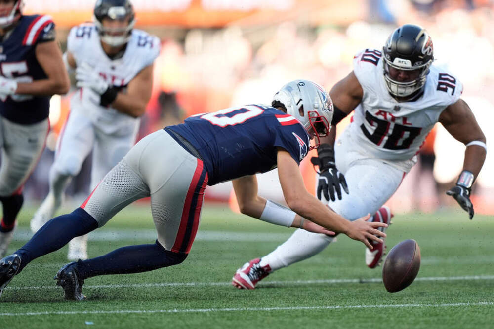 Patriots quarterback Drake Maye (10) retrieves his own fumble against Atlanta Falcons defensive tackle David Onyemata (90). (Robert F. Bukaty/AP)